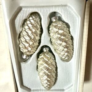 Three Sparkling Silver Pinecone holiday tree ornaments.